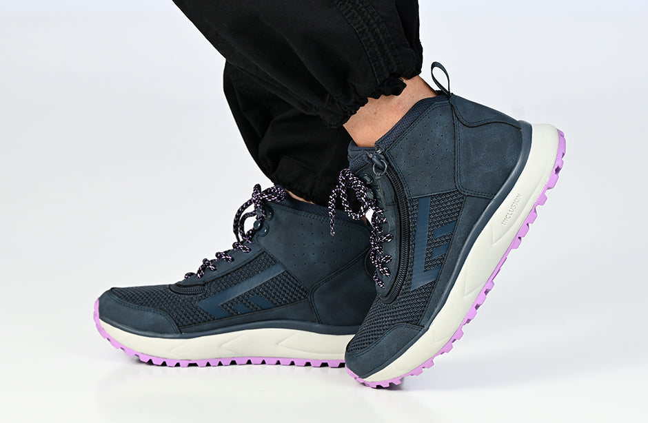 Woman wearing Women's Navy/Purple BILLY Inclusion Trail Boots for diabetes, plantar fasciitis, bunions, and orthotics.