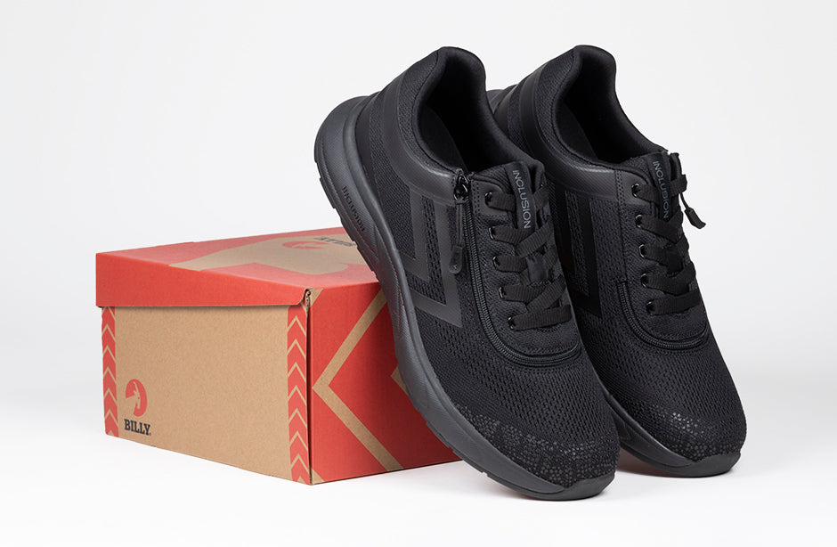 Men's black BILLY sneakers for diabetes and plantar fasciitis with padded collar, zipper, and wide fit on a shoebox.