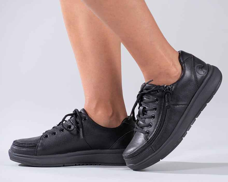 Women's Black to the Floor BILLY Work Comfort Lows, zipper shoes, like velcro, that are adaptive, accessible, inclusive and use universal design to accommodate an afo. Footwear is medium and wide width, M, D and EEE, are comfortable, and come in toddler, kids, mens, and womens sizing.