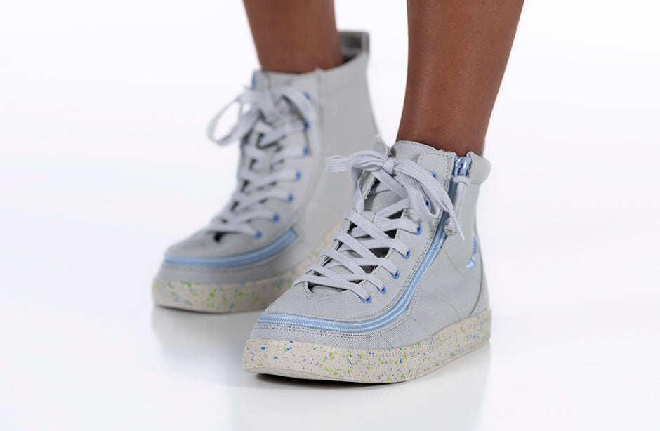 Kid wearing grey/blue speckle BILLY classic lace high tops with full wrap zipper, ideal shoes for diabetes, plantar fasciitis, and wide feet.