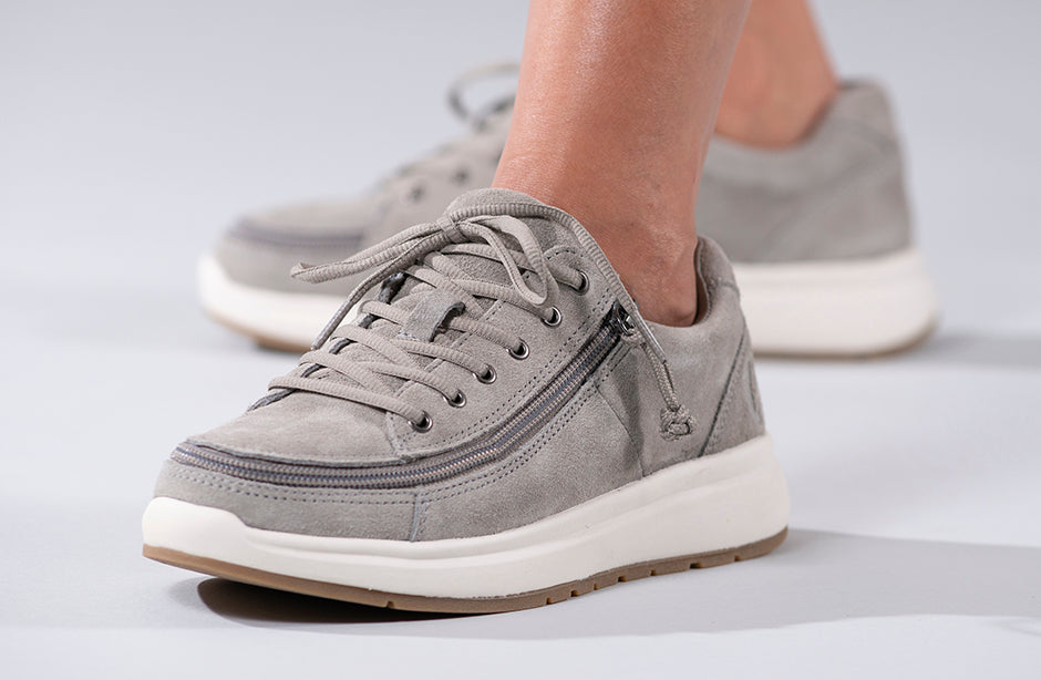 Women's Grey Suede BILLY Comfort Lows, zipper shoes, like velcro, that are adaptive, accessible, inclusive and use universal design to accommodate an afo. Footwear is medium and wide width, M, D and EEE, are comfortable, and come in toddler, kids, mens, and womens sizing.